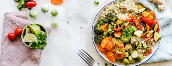 A plate of vegetables with a fork