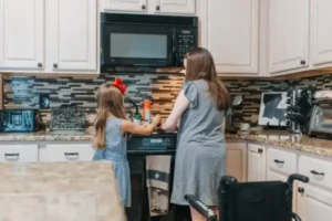 Mother and daughter in a kitchen preparing a meal