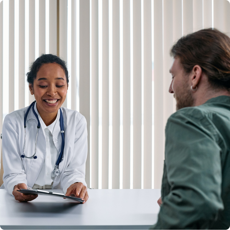 Doctor and their patient consulting at a table