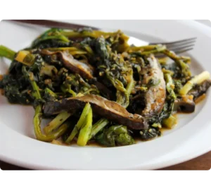 Sesame Broccoli Rabe on a plate with a fork