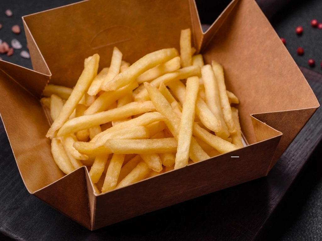 Fresh delicious crispy French fries with salt and spices